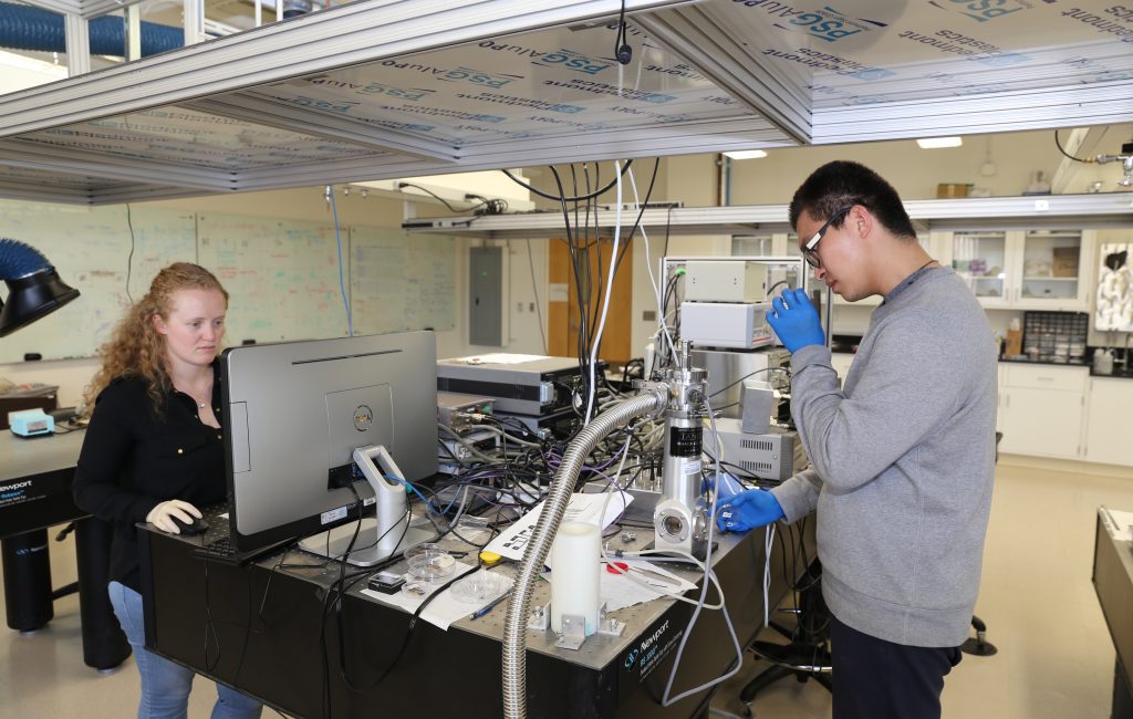 Two engineers working in a lab